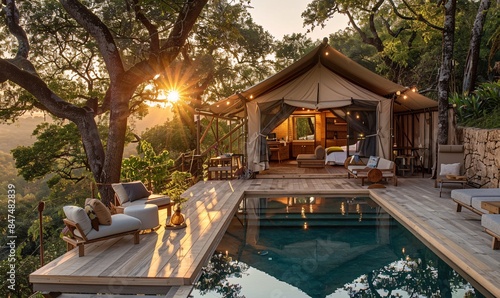 Luxury glamping: Inside tent, forested oak wood slope, private pool on terrace in golden hour photo