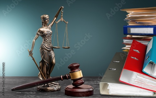 Wooden hammer on the judge table with documents