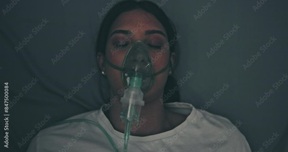 Hospital, emergency and woman on stretcher with mask, oxygen and transport to medical theater. Healthcare, crisis and patient on bed with ventilation, health insurance and trauma in ICU from above
