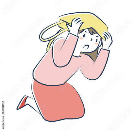 屈んで頭を守る女性