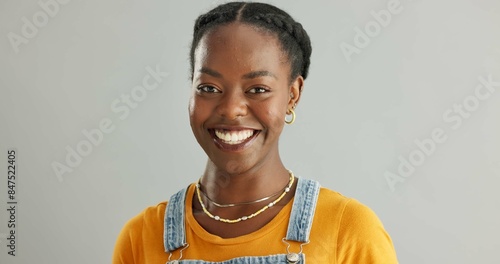 Black woman, studio and portrait with happiness for fashion, cool trend or clothes. Female student, gray background and smile for knowledge or education, wellness at university in New York City photo