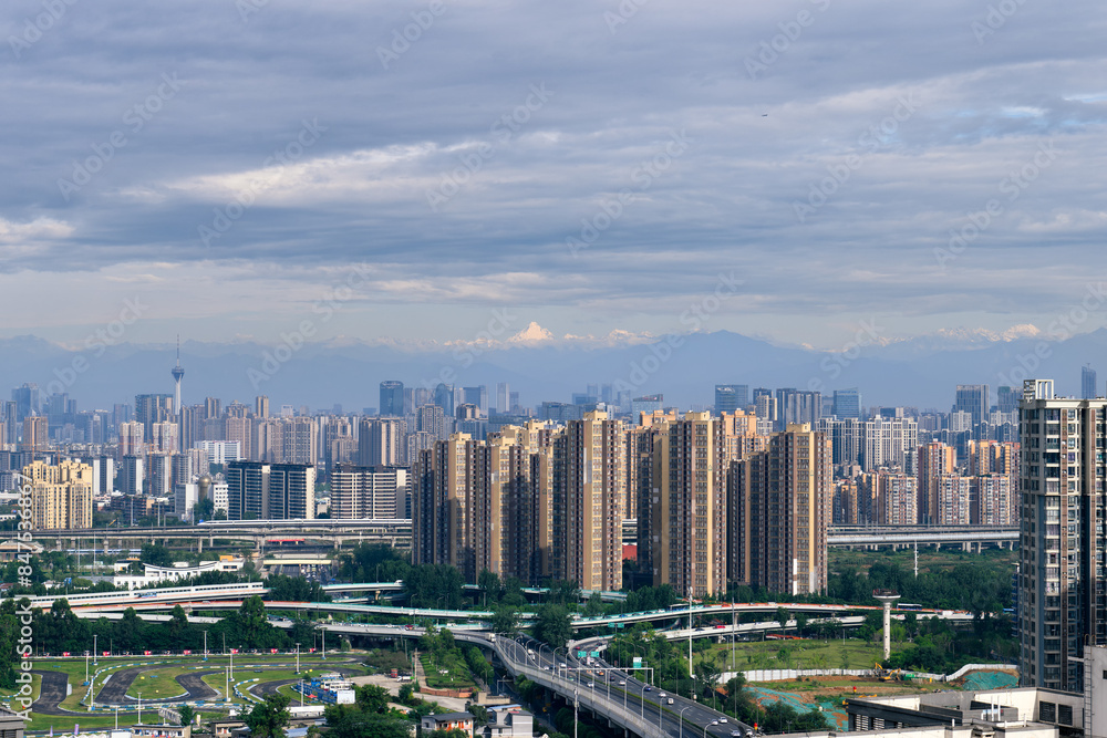 The downtown skyline in the morning with the highest peak of Mount Siguniang background in Chengdu, Sichuan province, China, which is called The downtown skyline in the morning with the highest peak of Mount Siguniang background in Chengdu, Sichuan province, China, which is called