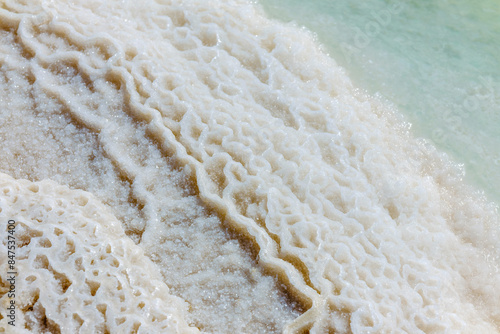 Natural salt deposits on the beach shoreline offer stunning beauty and tranquility