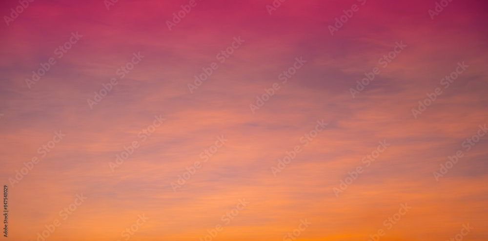 Obraz premium Enjoy a panoramic view of the skyline. The sun rises in the morning sky with colorful clouds. and beautiful cloud patterns In the soft light of the morning 
