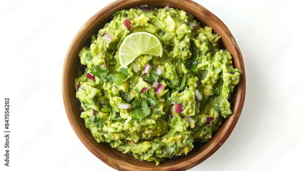Guacamole dip seen from above, creamy and fresh with chunks of avocado, lime, cilantro, and onions, in a bowl on a white background Guacamole dip seen from above, creamy and fresh with chunks of avocado, lime, cilantro, and onions, in a bowl on a white background