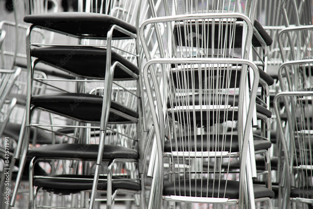 Shiny steel chairs stacked outdoor Shiny steel chairs stacked outdoor