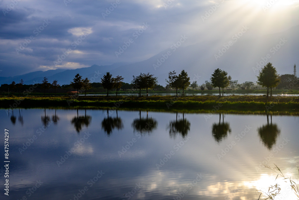 Scenic Lake with Tree Reflections on a Calm Sunny Day in Chishang, Taiwan Scenic Lake with Tree Reflections on a Calm Sunny Day in Chishang, Taiwan