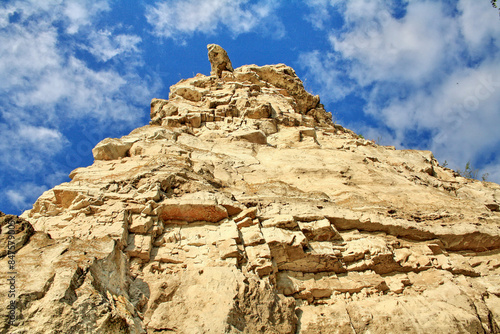 The rock of the mountain is called a camel, against the background of a blue sky, near the village of Shiryaevo, Samara region of Russia photo