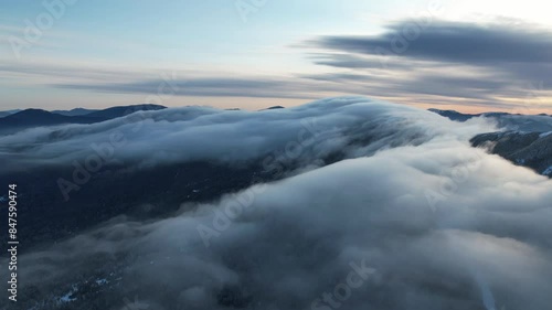 Timelapse of clouds over Saddleback Mountain, Maine in winter photo
