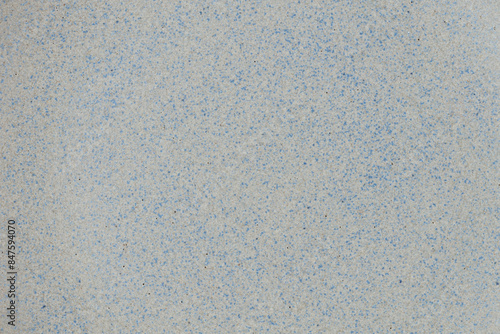 Blue and beige ceramic texture of plate with dots.