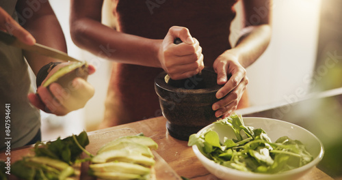 Fotografie Hands, couple and healthy food in kitchen with avocado, vegetables and leaves for breakfast or lunch