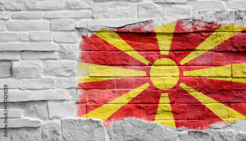 Flag of Macedonia painted on a white textured brick wall