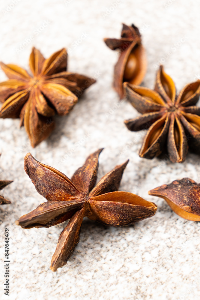 Spice star anise closeup on gray stone background Spice star anise closeup on gray stone background