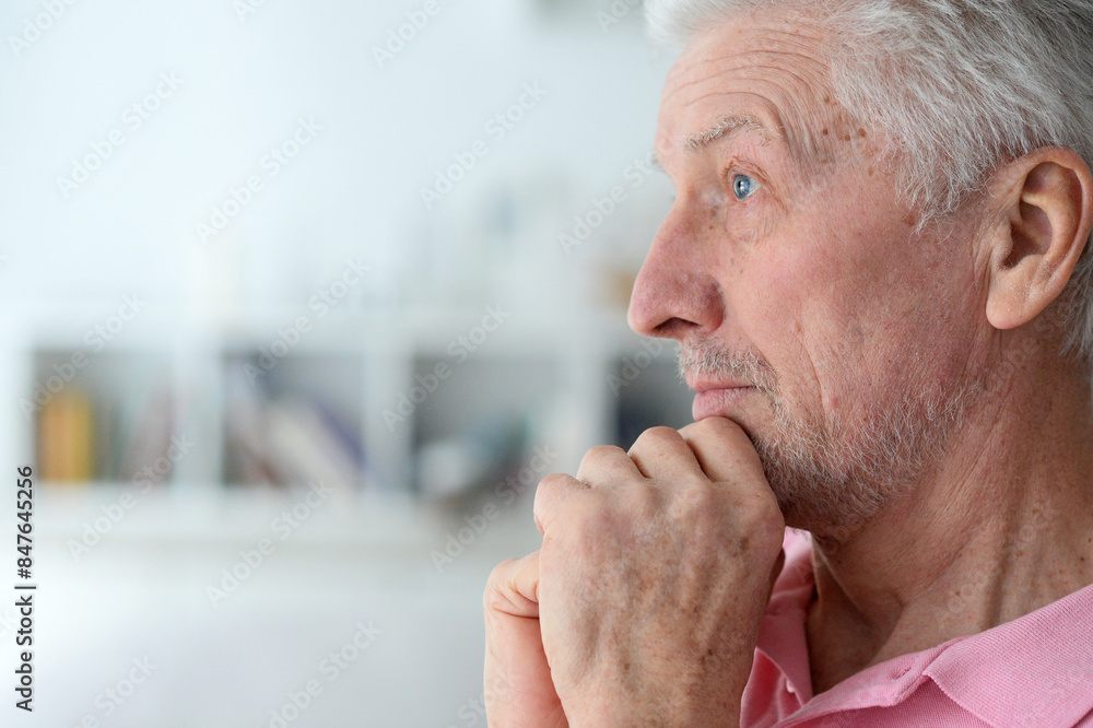 close-up portrait of a senior man thinking about something close-up portrait of a senior man thinking about something