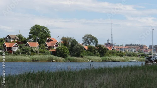 Red Summer Houses Along River, Karlskrona, Sweden photo