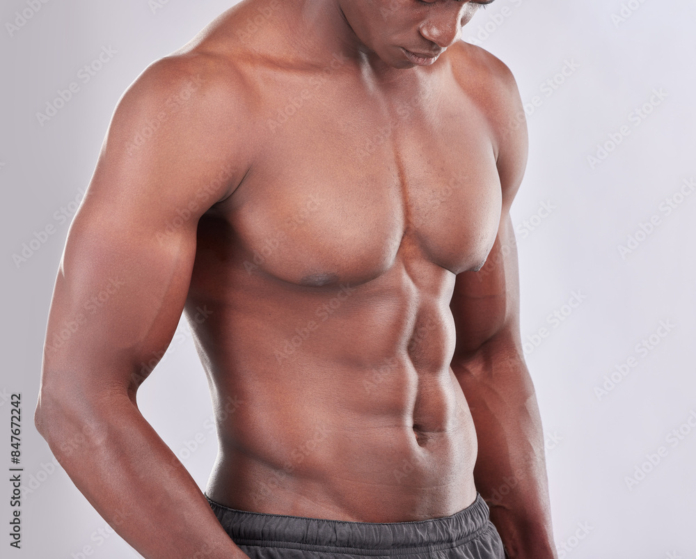 Fototapeta premium Stomach, muscle and black man for fitness with exercise and sports training in studio. African bodybuilder, strong body and abdomen with abs for wellness or health and six pack by white background