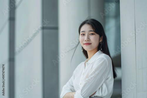 Smiling Asian Businesswoman in Office Building Background Free Download Smiling Asian Businesswoman in Office Building Background - GFXLoad