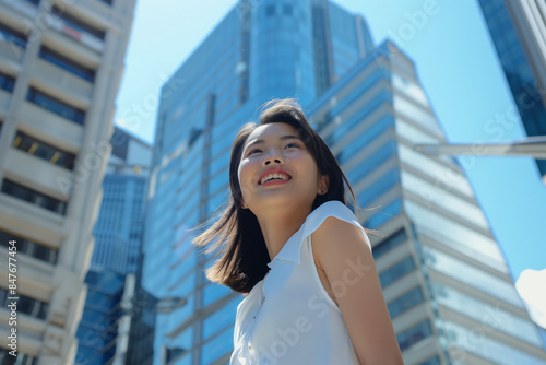Smiling Asian Businesswoman in Office Building Background Free Download Smiling Asian Businesswoman in Office Building Background - GFXLoad