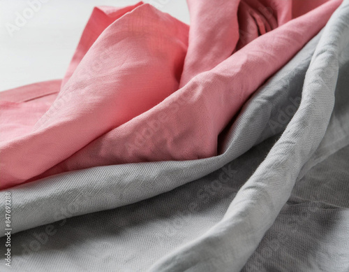 Close-up of gray and pink  linen pieces of fabric  photo