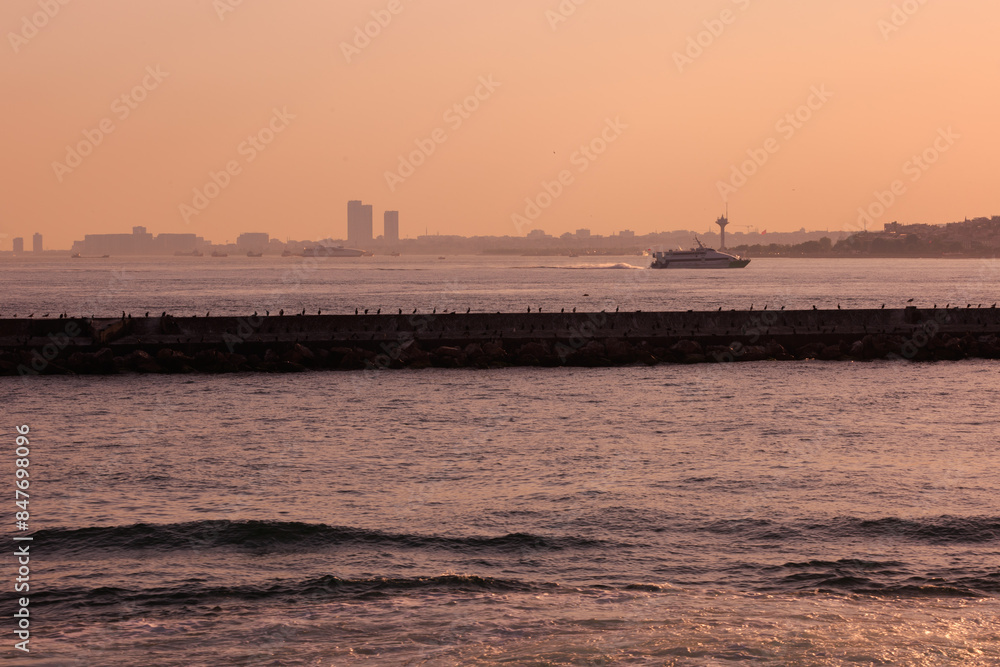 Evening sea view off the coast of Istanbul. Orange sunset sky Evening sea view off the coast of Istanbul. Orange sunset sky