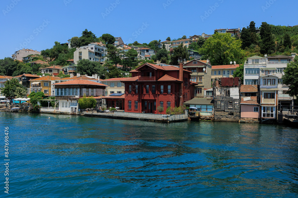 Obraz premium Blue seascape overlooking the coast. View of the Bosphorus in Istanbul city on sunny summer day, in a public place.