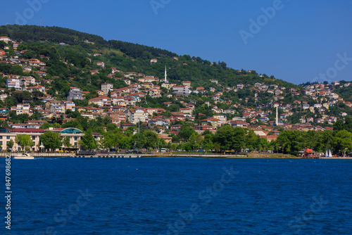 Blue seascape overlooking the coast. View of the Bosphorus in Istanbul city on sunny summer day, in a public place.