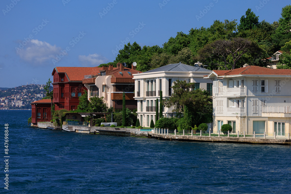 Obraz premium Blue seascape overlooking the coast. View of the Bosphorus in Istanbul city on sunny summer day, in a public place.