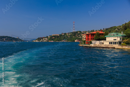 Blue seascape overlooking the coast. View of the Bosphorus in Istanbul city on sunny summer day, in a public place.