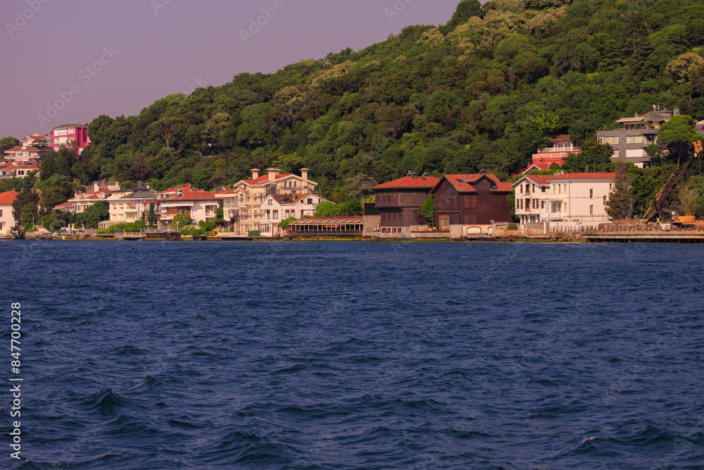 Fototapeta premium Blue seascape overlooking the coast. View of the Bosphorus in Istanbul city on sunny summer day, in a public place.