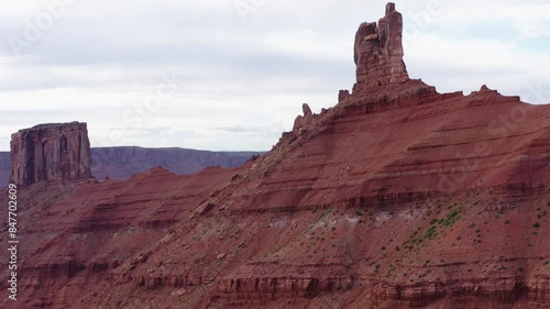 Large Natural rock formation, Parriot Mesa, in Utah desert, Moab. Aerial orbiting shot photo