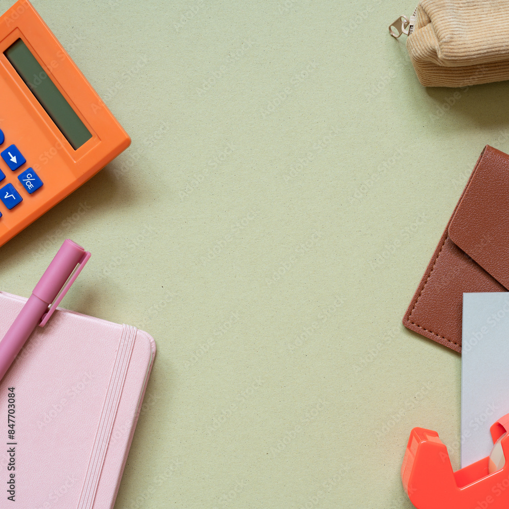 Various office and school supply. calculator, pen, notebook, pencil case, card wallet, memo pad, tape dispenser on khaki desk background. top view