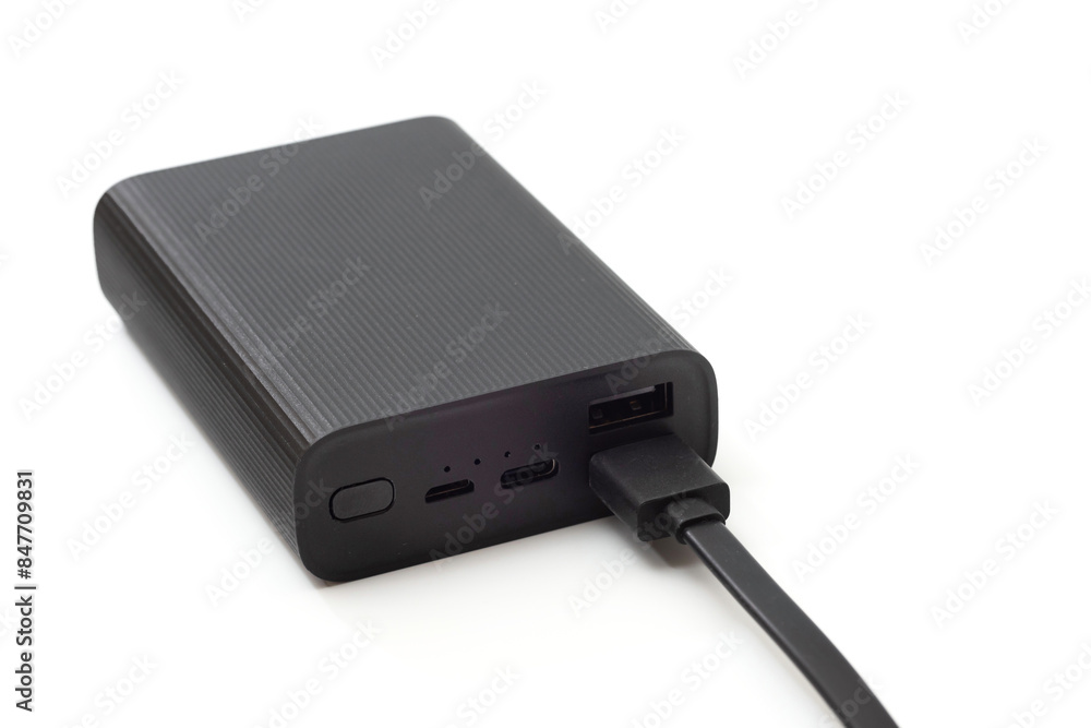 Autonomous external battery for charging mobile and other devices, isolated on a white background. Autonomous external battery for charging mobile and other devices, isolated on a white background.