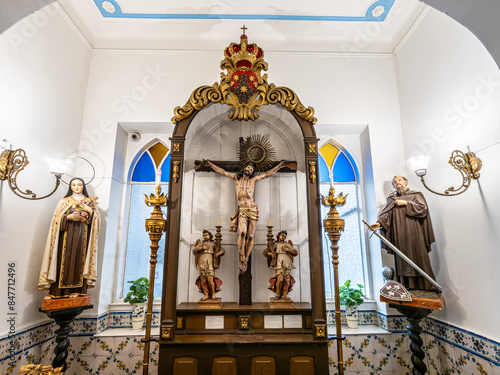 The intricate golden interior of the Carmelite church Igreja do Carmo in the old town of Faro in Portugal