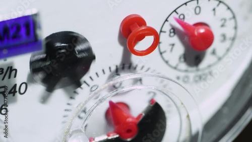 Water meter shows household consumption of water, close up. Water meter in box with pipes built into the wall . Water consumption measuring device. 