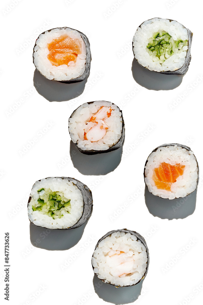 Various maki rolls with shrimp, salmon, cucumber on a white background with hard shadows Various maki rolls with shrimp, salmon, cucumber on a white background with hard shadows
