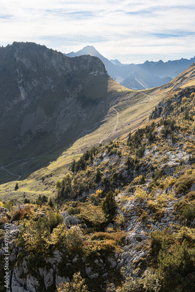 Aerial view of Swiss Alps near Fronalpstock in Stoos, Switzerland. Walking trails in mountains. Bright, sunny day.