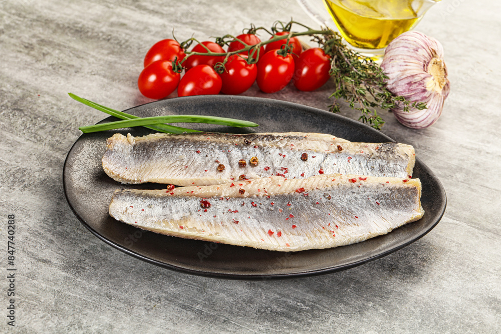 Marinated herring fillet with green onion