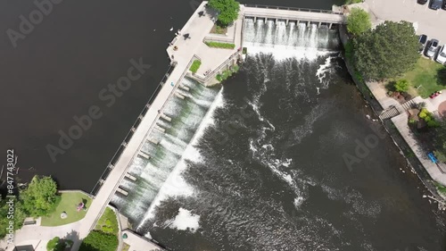 Wallpaper Mural Dam on Rogue River in Rockford, Michigan with drone video overhead stable. Torontodigital.ca