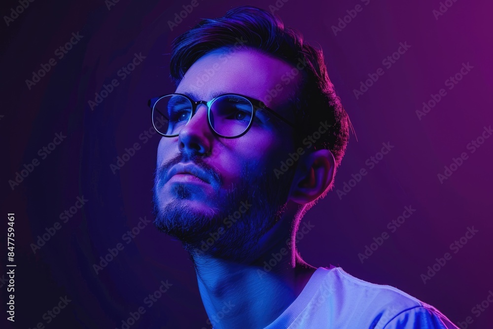 Fototapeta premium Serious successful man in glasses against neon purple background.