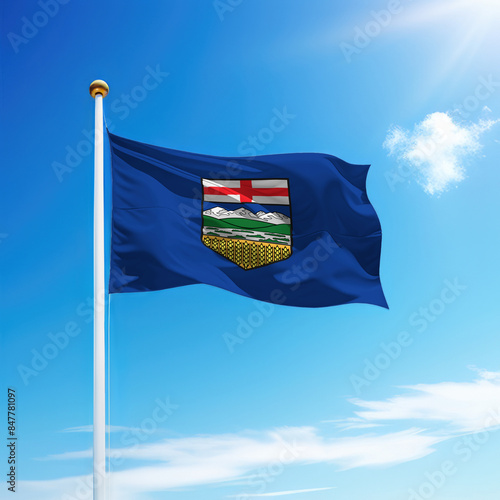 Waving flag of Alberta is a province of Canada on flagpole