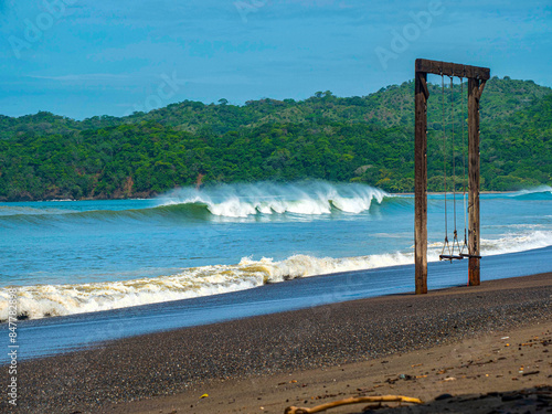 Surf spot with perfect breaking waves and offshore wind at stunning playa Venao