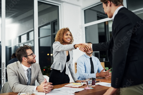 Business people, handshake and meeting success, hiring or onboarding at night with b2b collaboration and team work. Accounting group, woman and clients shaking hands for agreement and deal at night