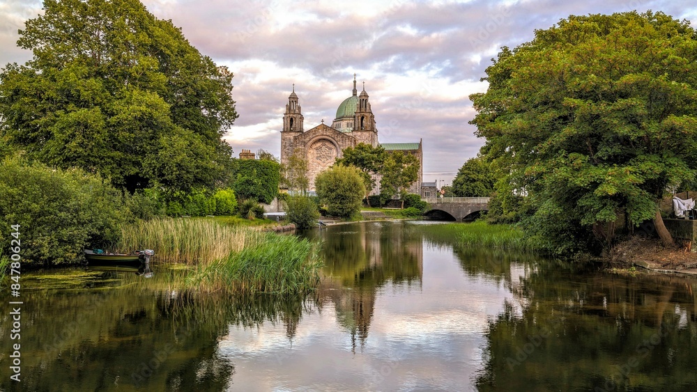 Galway cathedral reflected in the Corrib river in Galway city, Ireland, Irish landmark, buildings and architecture