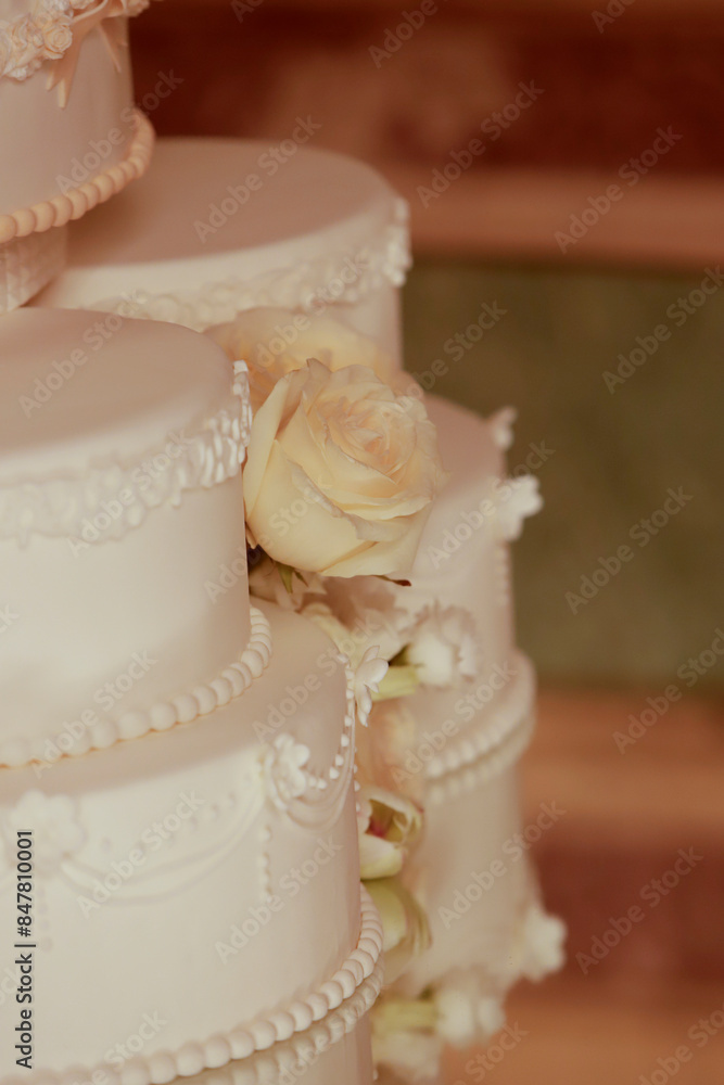 detail of wedding cake decorated with natural flowers detail of wedding cake decorated with natural flowers