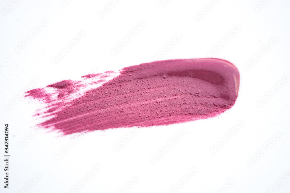 Fototapeta premium Pink shimmering lipstick texture stroke isolated on white background. Cosmetic product swatch