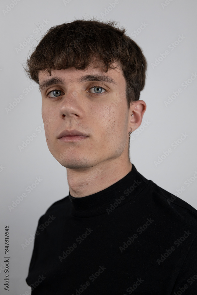 Fototapeta premium White background portrait in studio of young man.