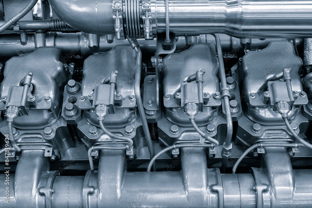 Black diesel engine. Fragment of a diesel motor close-up. Selective on the fuel injection in the the diesel engine. supply system for diesel fuel. Engine details Diesel engine backgroundclose up Black diesel engine. Fragment of a diesel motor close-up. Selective on the fuel injection in the the diesel engine. supply system for diesel fuel. Engine details Diesel engine backgroundclose up