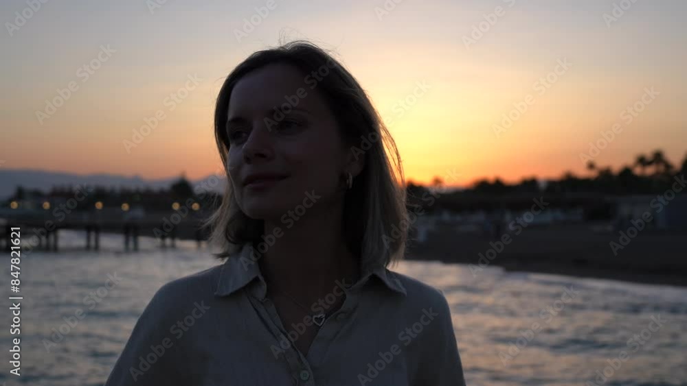 Golden Stroll: Woman Enjoys Sunset Walk on the Beach Golden Stroll: Woman Enjoys Sunset Walk on the Beach