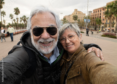 Photography Selfie portrait of a heterosexual retired couple having fun in a city