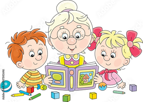 Funny grandma reading aloud an interesting fairy tale book to her happy little grandson and granddaughter at their table with scattered toys, vector cartoon illustration on a white background